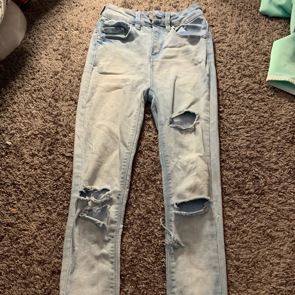 Light blue ripped jeans